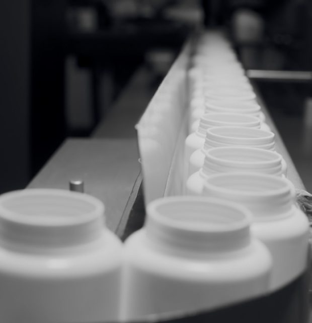 Production,Of,Dietary,Supplements.,White,Plastic,Cans,For,Tablets,On